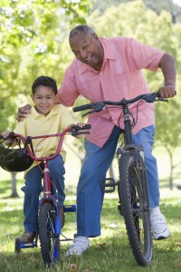 grandson and dad on bikes